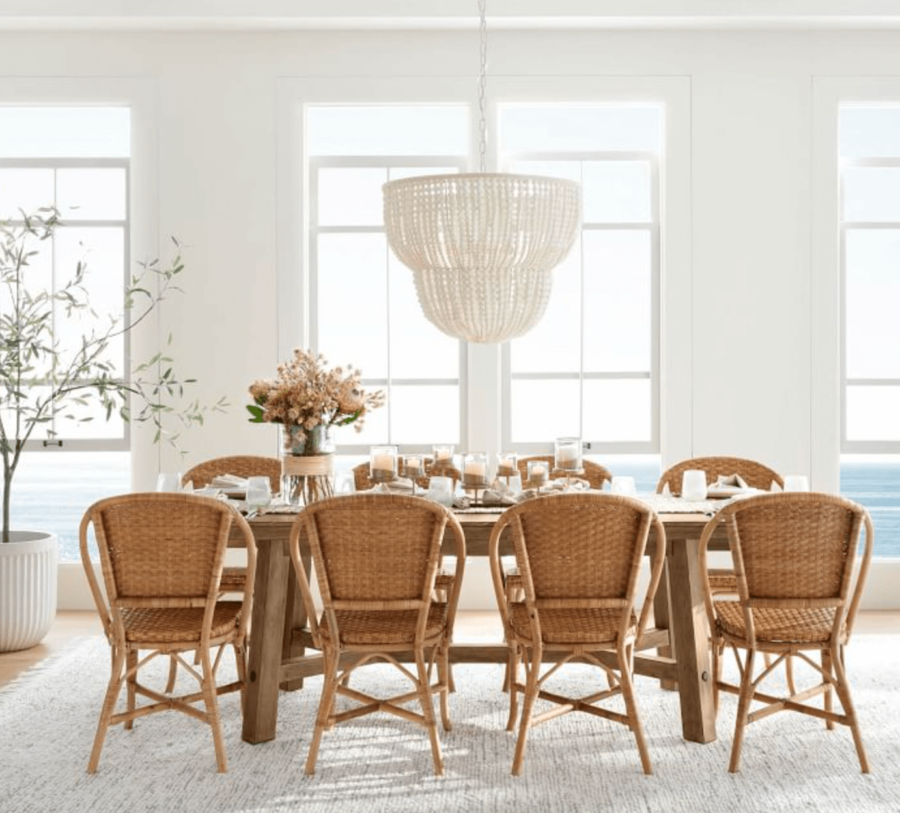 Wood bead chandelier over dining room table